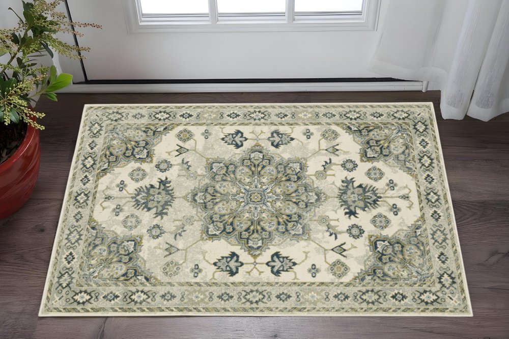 3' X 5' Ivory Blue Teal Grey And Olive Green Oriental Power Loom Stain Resistant Area Rug