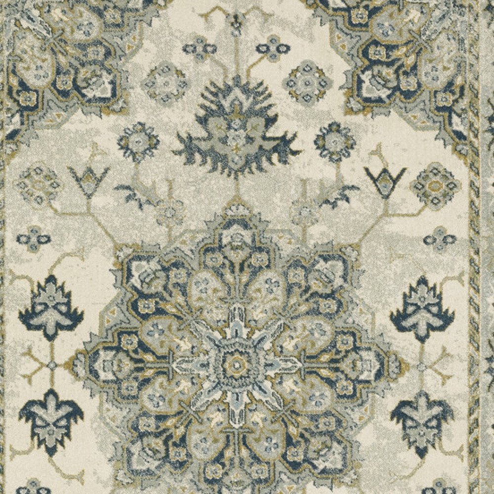 5' X 7' Ivory Blue Teal Grey And Olive Green Oriental Power Loom Stain Resistant Area Rug
