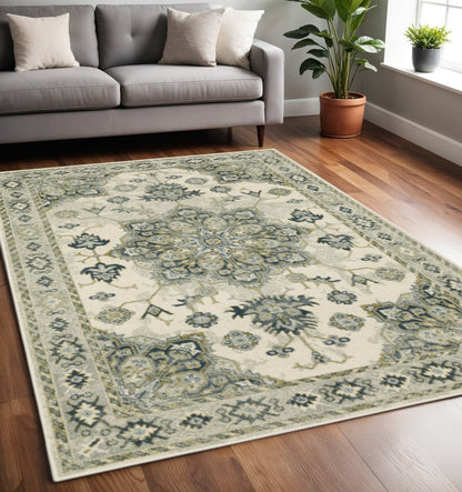 5' X 7' Ivory Blue Teal Grey And Olive Green Oriental Power Loom Stain Resistant Area Rug