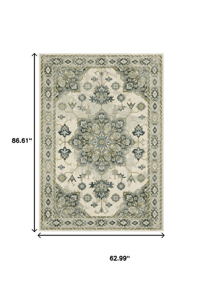 5' X 7' Ivory Blue Teal Grey And Olive Green Oriental Power Loom Stain Resistant Area Rug