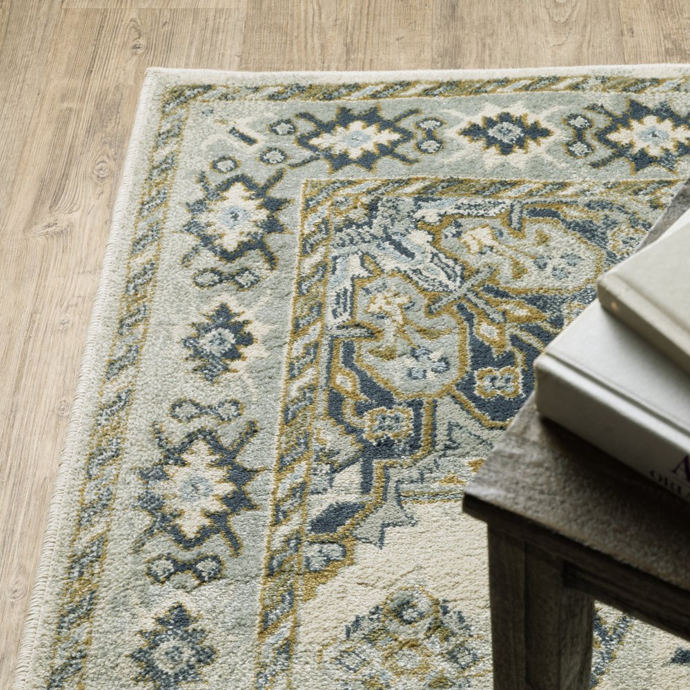 7' X 9' Ivory And Blue Oriental Distressed Area Rug