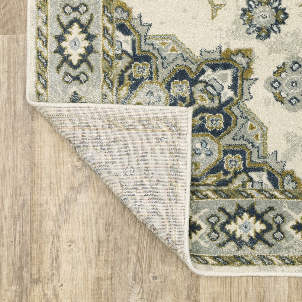 7' X 9' Ivory And Blue Oriental Distressed Area Rug
