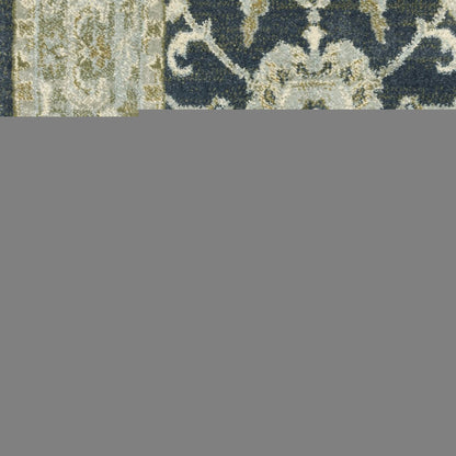 5' X 7' Teal Blue Ivory Green And Grey Oriental Power Loom Stain Resistant Area Rug