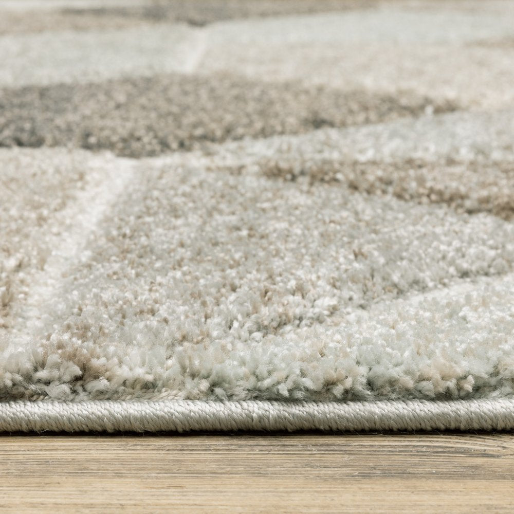 7' X 10' Gray And Ivory Geometric Area Rug
