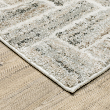 5' X 8' Ivory Beige Grey Brown Pale Blue And Charcoal Geometric Power Loom Stain Resistant Area Rug