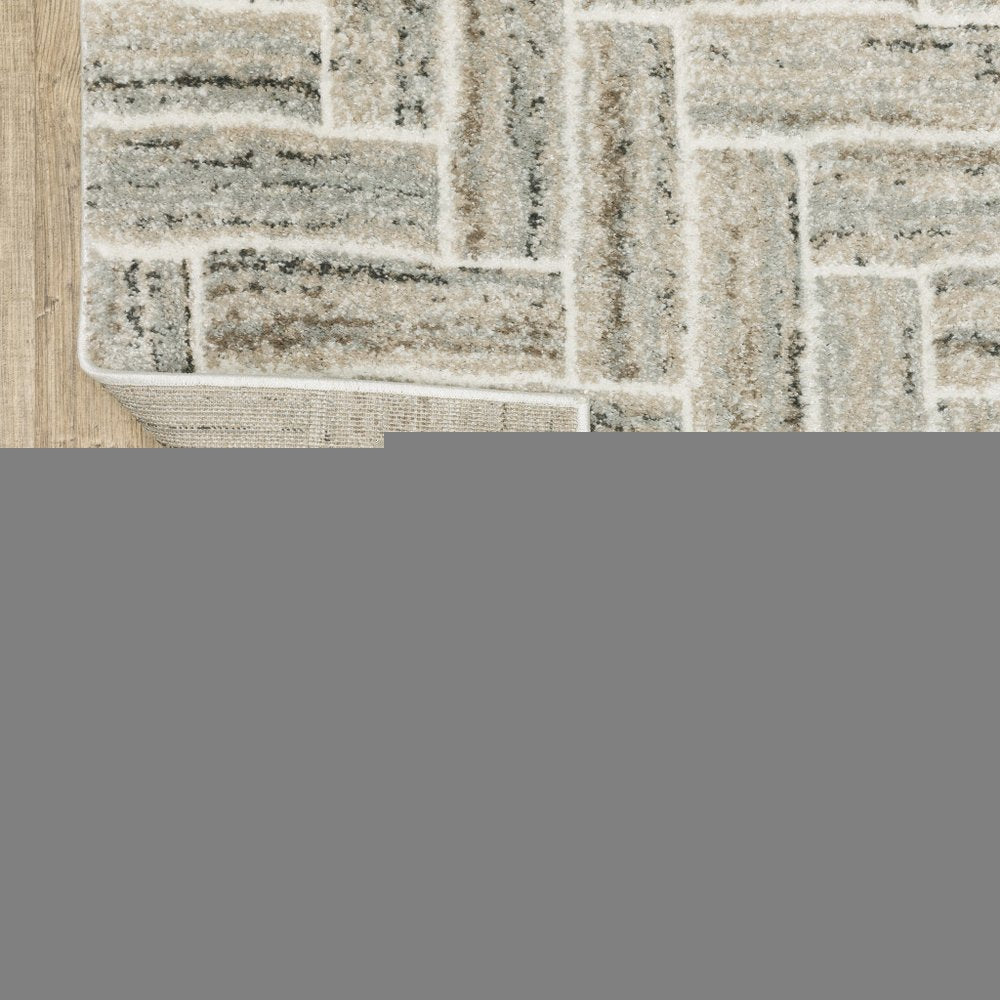 5' X 8' Ivory Beige Grey Brown Pale Blue And Charcoal Geometric Power Loom Stain Resistant Area Rug