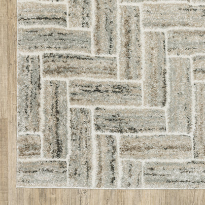 5' X 8' Ivory Beige Grey Brown Pale Blue And Charcoal Geometric Power Loom Stain Resistant Area Rug