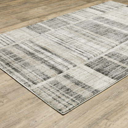 3' X 5' Grey Charcoal Ivory Tan Brown And Beige Geometric Power Loom Stain Resistant Area Rug