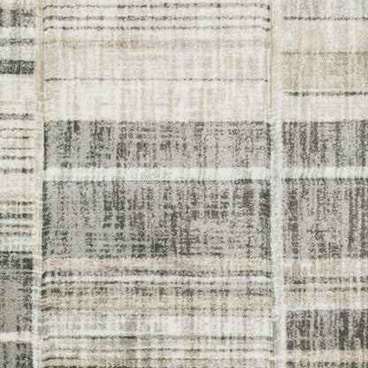 6' X 9' Grey Charcoal Ivory Tan Brown And Beige Geometric Power Loom Stain Resistant Area Rug