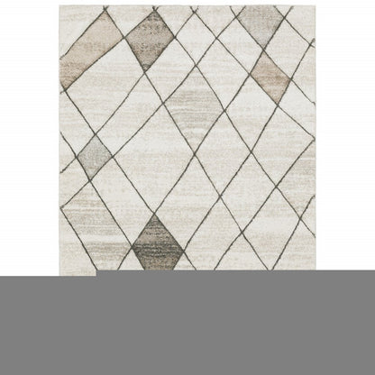 5' X 8' Beige Grey Tan And Brown Geometric Power Loom Stain Resistant Area Rug
