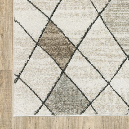 5' X 8' Beige Grey Tan And Brown Geometric Power Loom Stain Resistant Area Rug