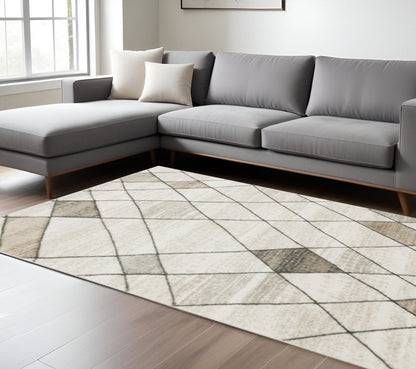 10' X 13' Beige Grey Tan And Brown Geometric Power Loom Stain Resistant Area Rug