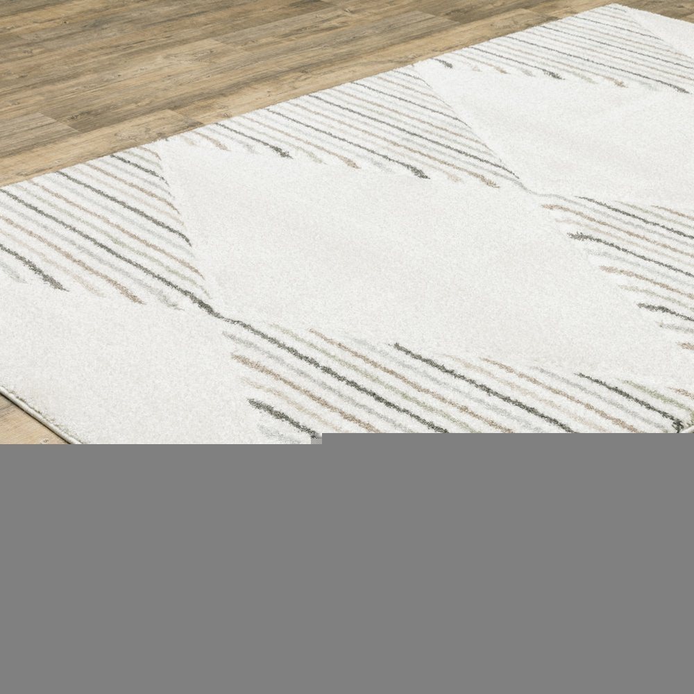 6' X 9' Beige Grey Sage Green Pale Blue Brown And Charcoal Geometric Power Loom Stain Resistant Area Rug