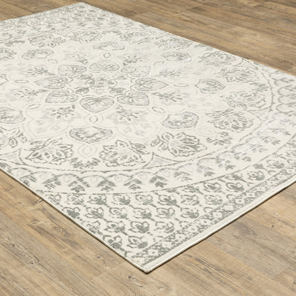 5' X 8' Ivory And Grey Floral Power Loom Stain Resistant Area Rug