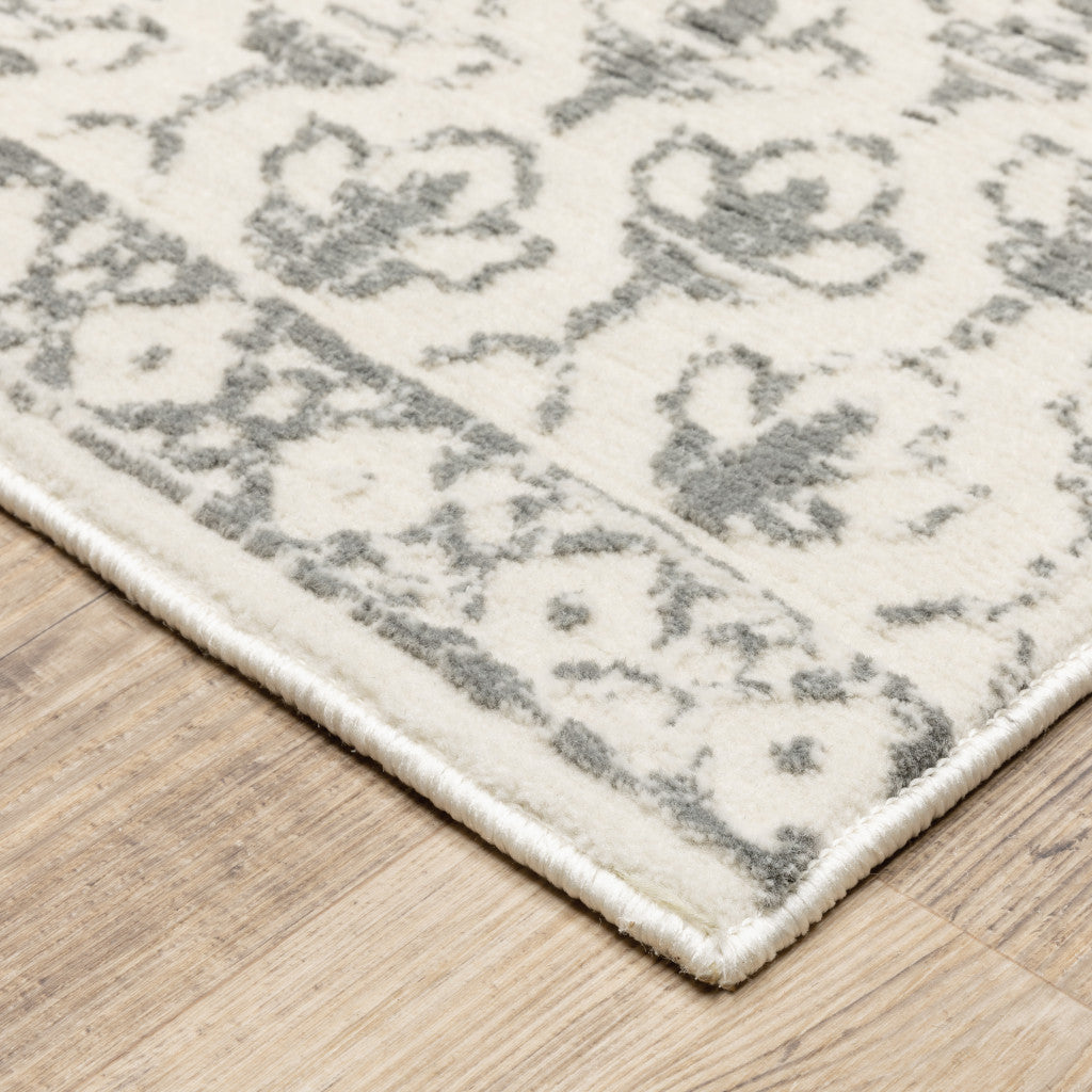 6' X 9' Ivory And Grey Floral Power Loom Stain Resistant Area Rug