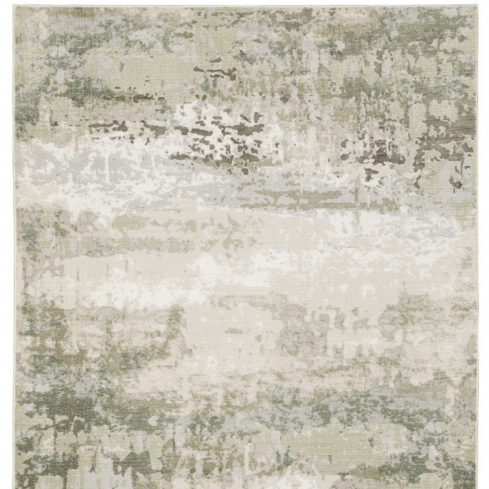 5' X 8' Beige And Green Abstract Distressed Area Rug