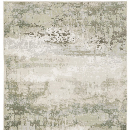 5' X 8' Beige And Green Abstract Distressed Area Rug