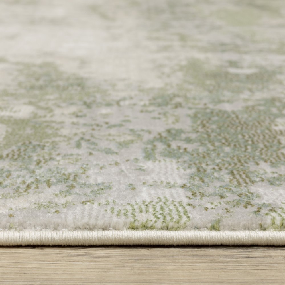 5' X 8' Beige And Green Abstract Distressed Area Rug