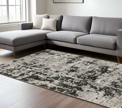 6' X 9' Grey Charcoal Black And Ivory Abstract Power Loom Stain Resistant Area Rug