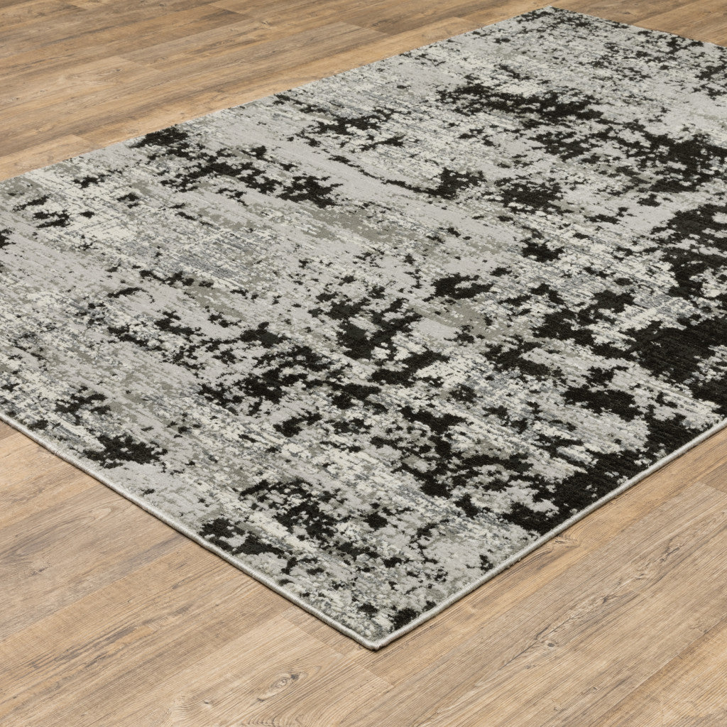 10' X 13' Grey Charcoal Black And Ivory Abstract Power Loom Stain Resistant Area Rug