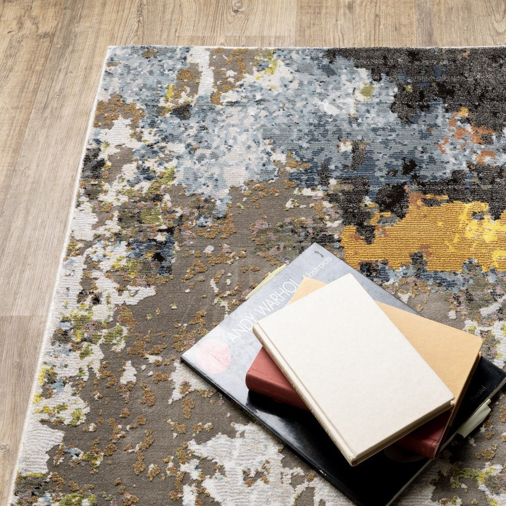 7' X 10' Beige Green And Orange Abstract Area Rug
