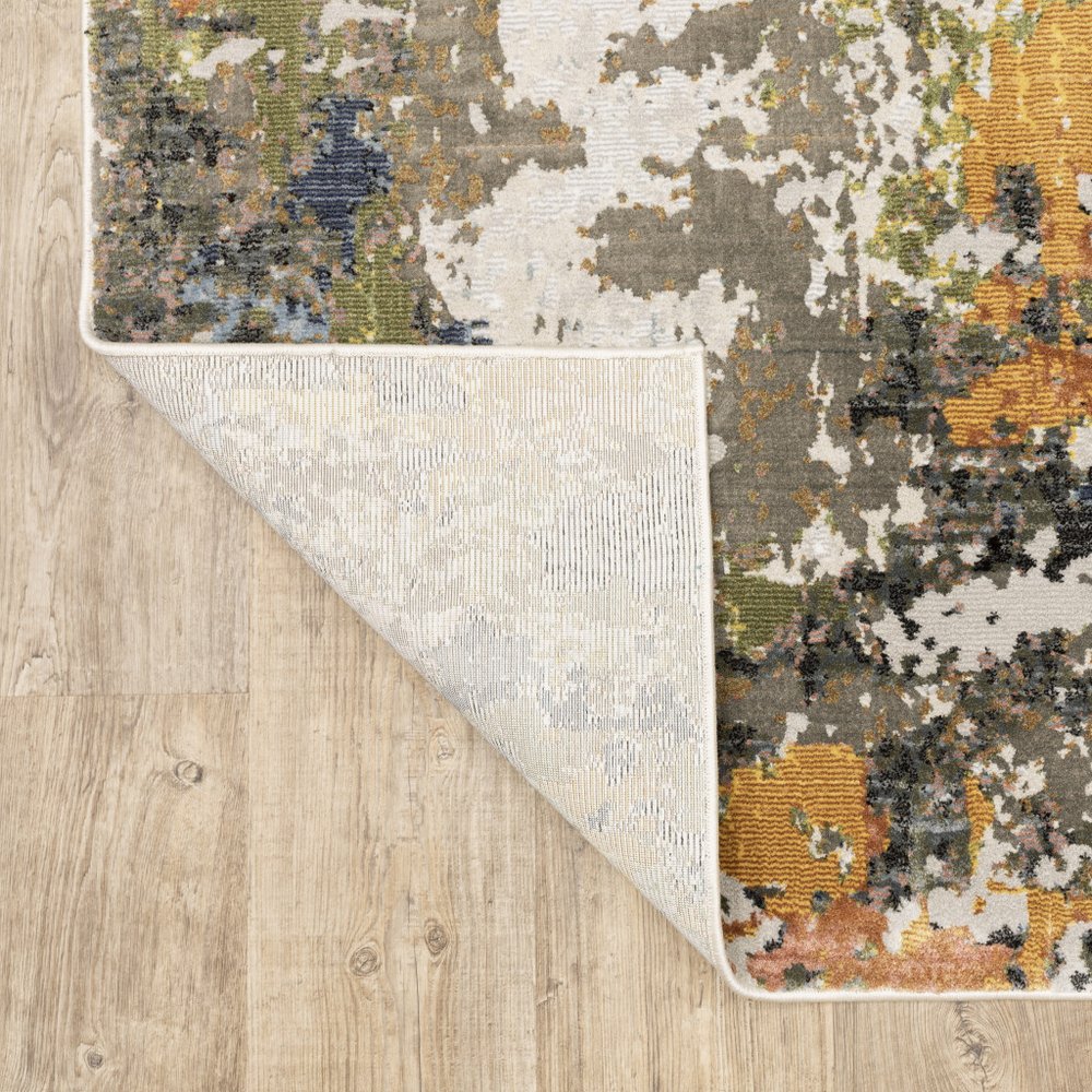 7' X 10' Beige Green And Orange Abstract Area Rug