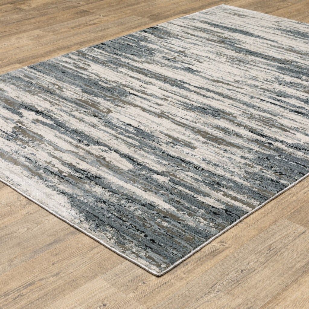 3' X 5' Blue Grey Beige And Brown Abstract Power Loom Stain Resistant Area Rug