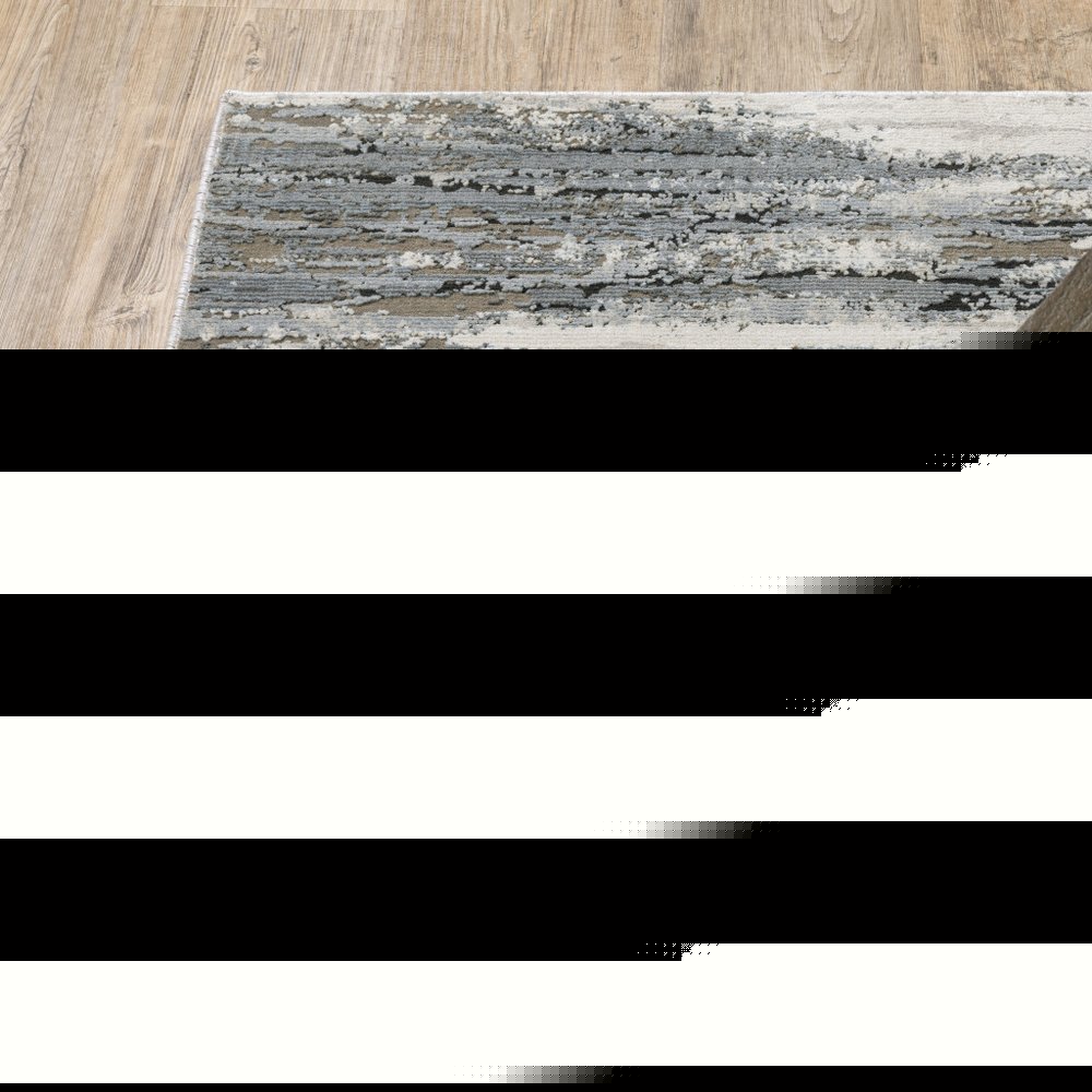 5' X 8' Blue Grey Beige And Brown Abstract Power Loom Stain Resistant Area Rug