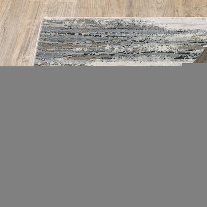 5' X 8' Blue Grey Beige And Brown Abstract Power Loom Stain Resistant Area Rug
