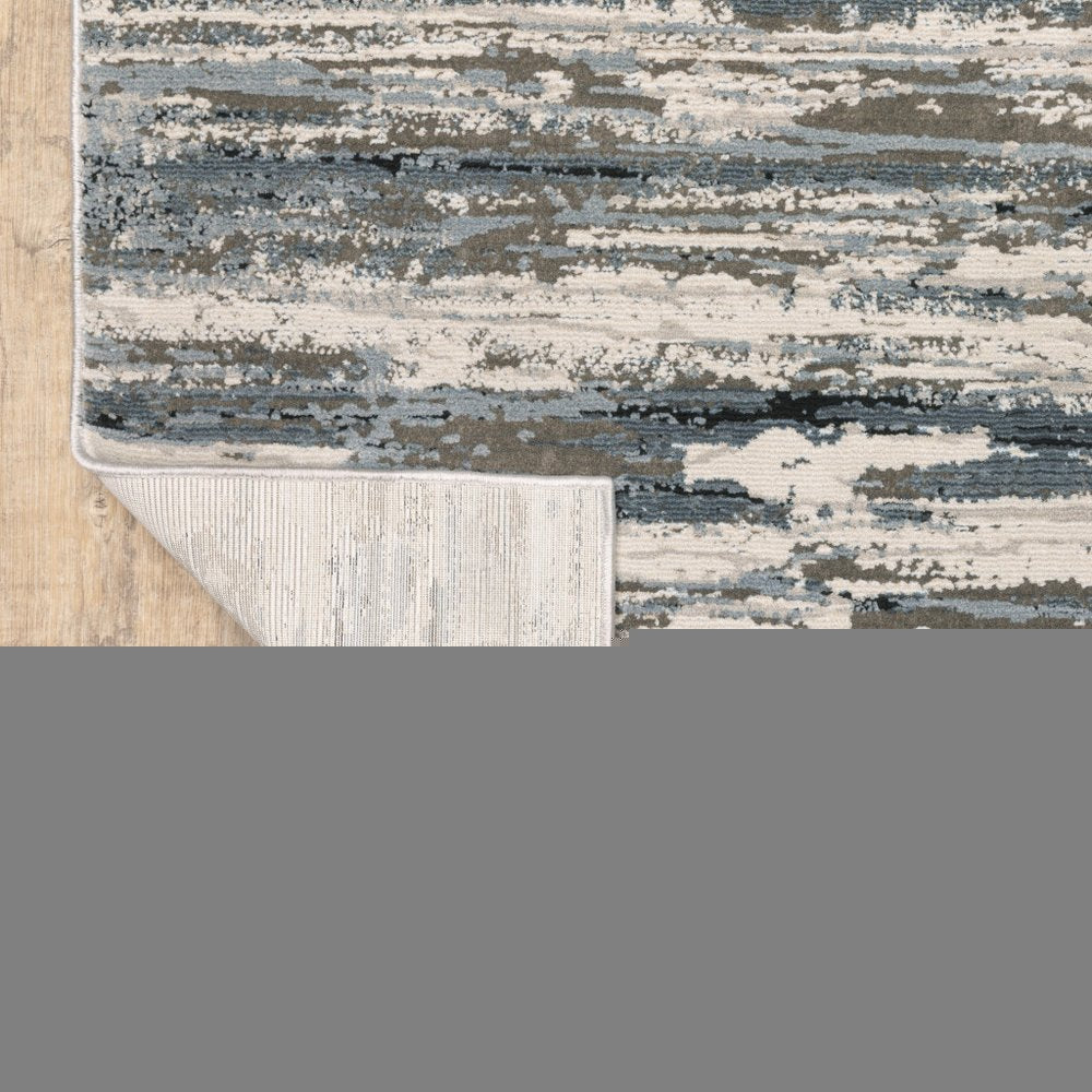 5' X 8' Blue Grey Beige And Brown Abstract Power Loom Stain Resistant Area Rug