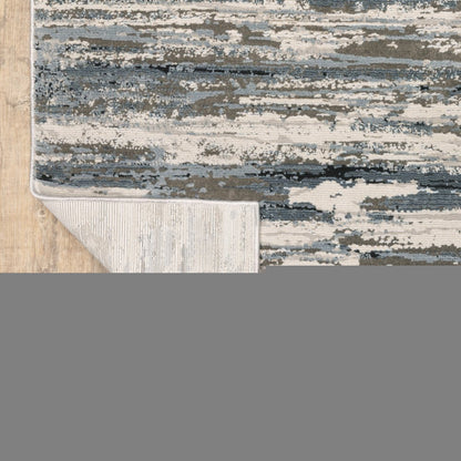 5' X 8' Blue Grey Beige And Brown Abstract Power Loom Stain Resistant Area Rug