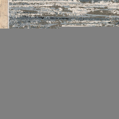 8' X 11' Blue Grey Beige And Brown Abstract Power Loom Stain Resistant Area Rug