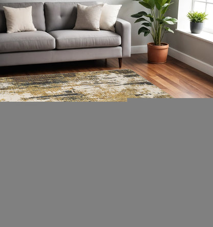 5' X 8' Gold Brown Rust Grey Blue And Beige Abstract Power Loom Stain Resistant Area Rug
