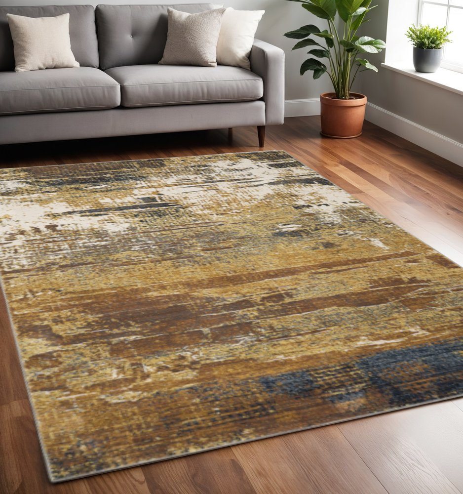 5' X 8' Gold Brown Rust Grey Blue And Beige Abstract Power Loom Stain Resistant Area Rug