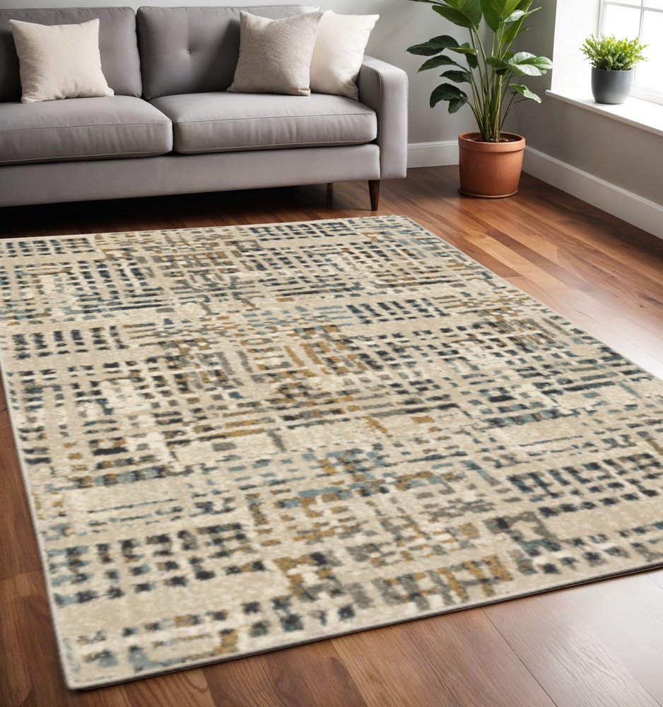 5' X 7' Beige Grey Blues Orange Yellow And Ivory Abstract Power Loom Stain Resistant Area Rug