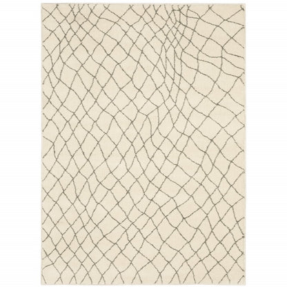 5' X 7' Ivory And Grey Geometric Power Loom Stain Resistant Area Rug