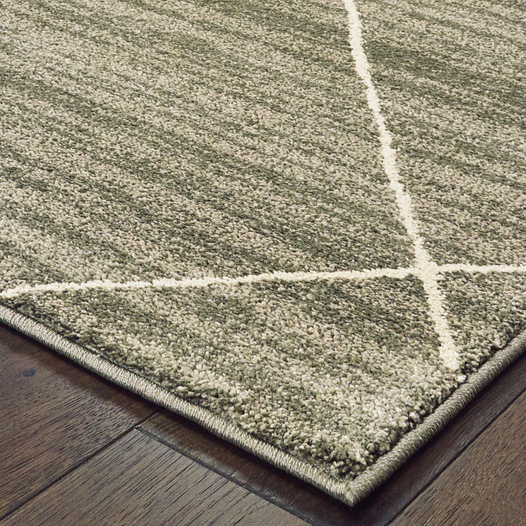 5' X 7' Grey And Ivory Geometric Power Loom Stain Resistant Area Rug