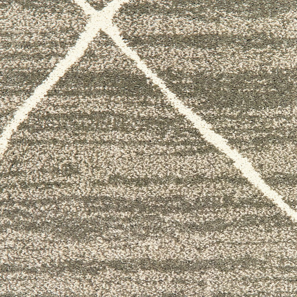 7' X 9' Gray And Ivory Geometric Shag Area Rug