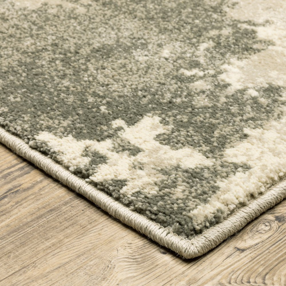 7' X 9' Beige And Ivory Abstract Shag Area Rug