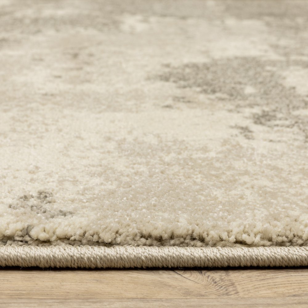 7' X 9' Beige And Ivory Abstract Shag Area Rug