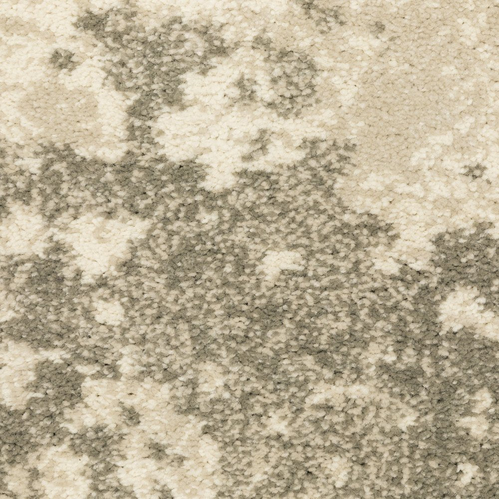 7' X 9' Beige And Ivory Abstract Shag Area Rug