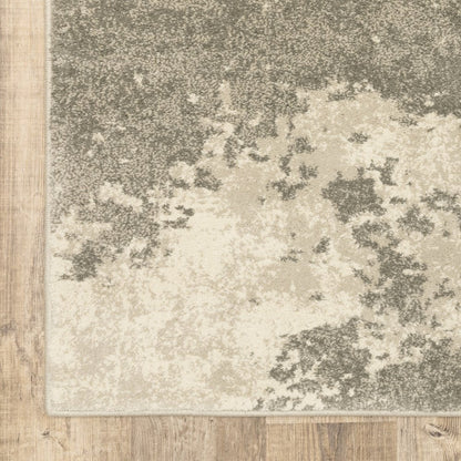 7' X 9' Beige And Ivory Abstract Shag Area Rug