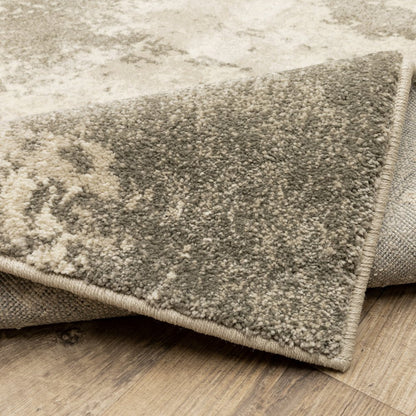 7' X 9' Beige And Ivory Abstract Shag Area Rug