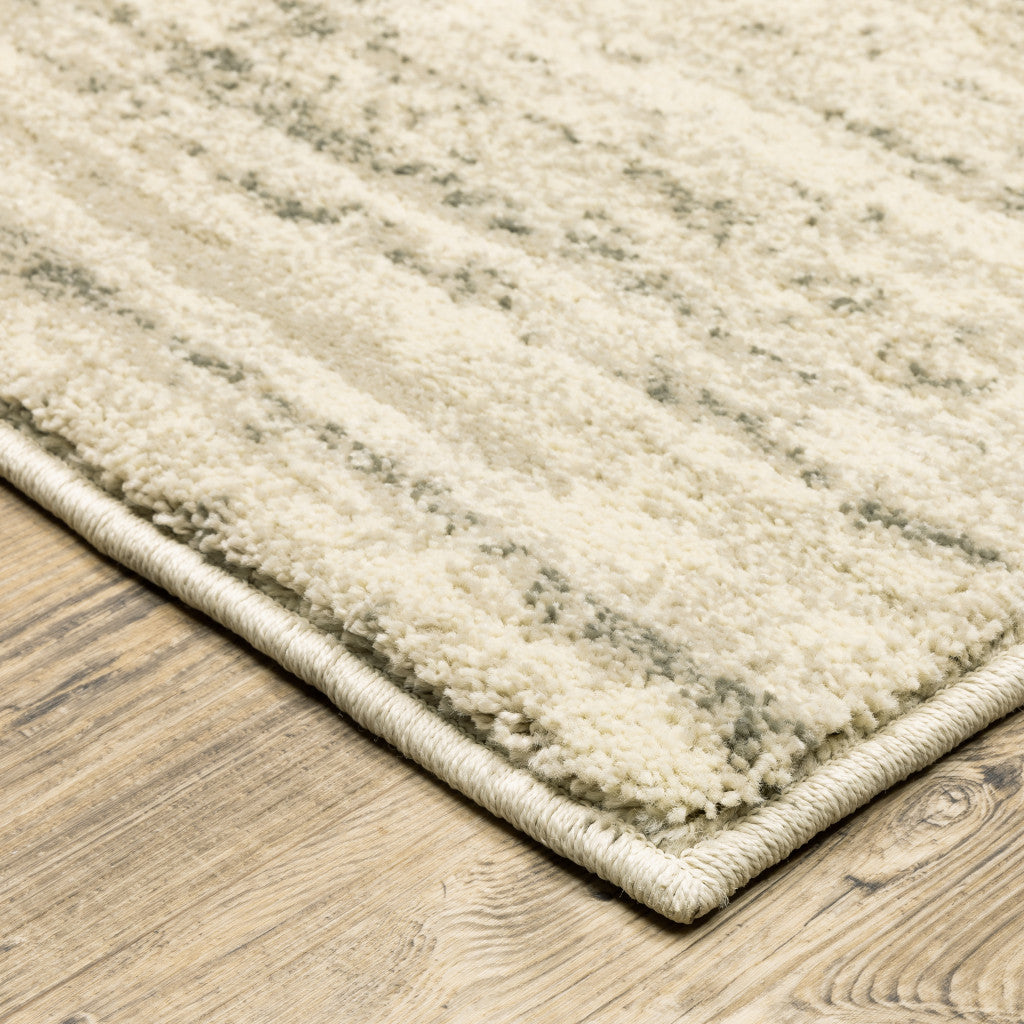 5' X 7' Beige And Grey Abstract Power Loom Stain Resistant Area Rug