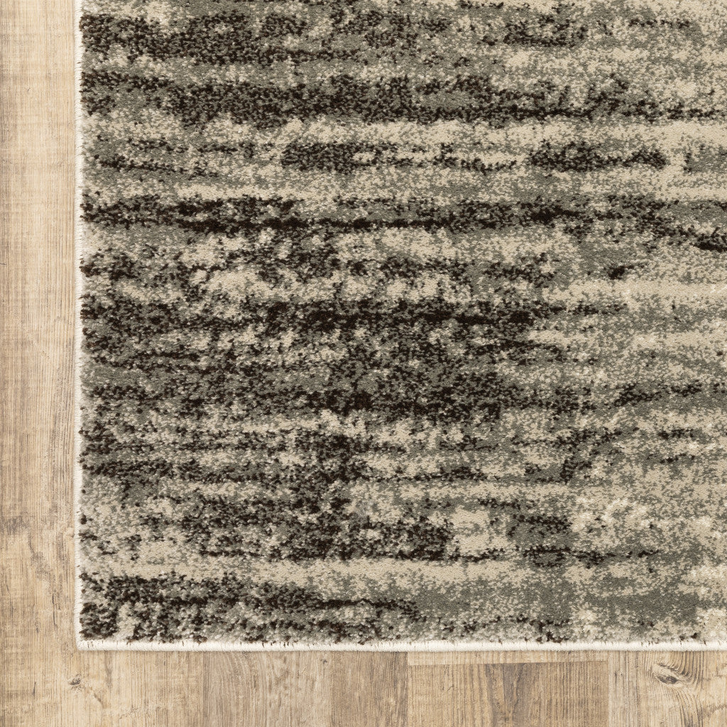 5' X 7' Beige And Grey Abstract Power Loom Stain Resistant Area Rug