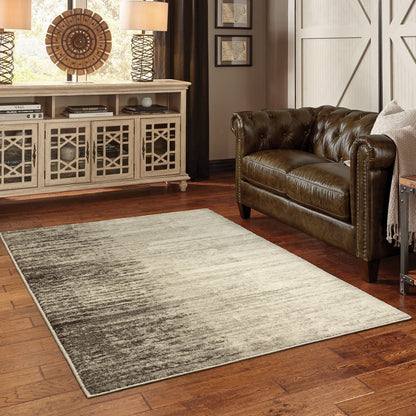 7' X 9' Beige And Ivory Abstract Shag Area Rug