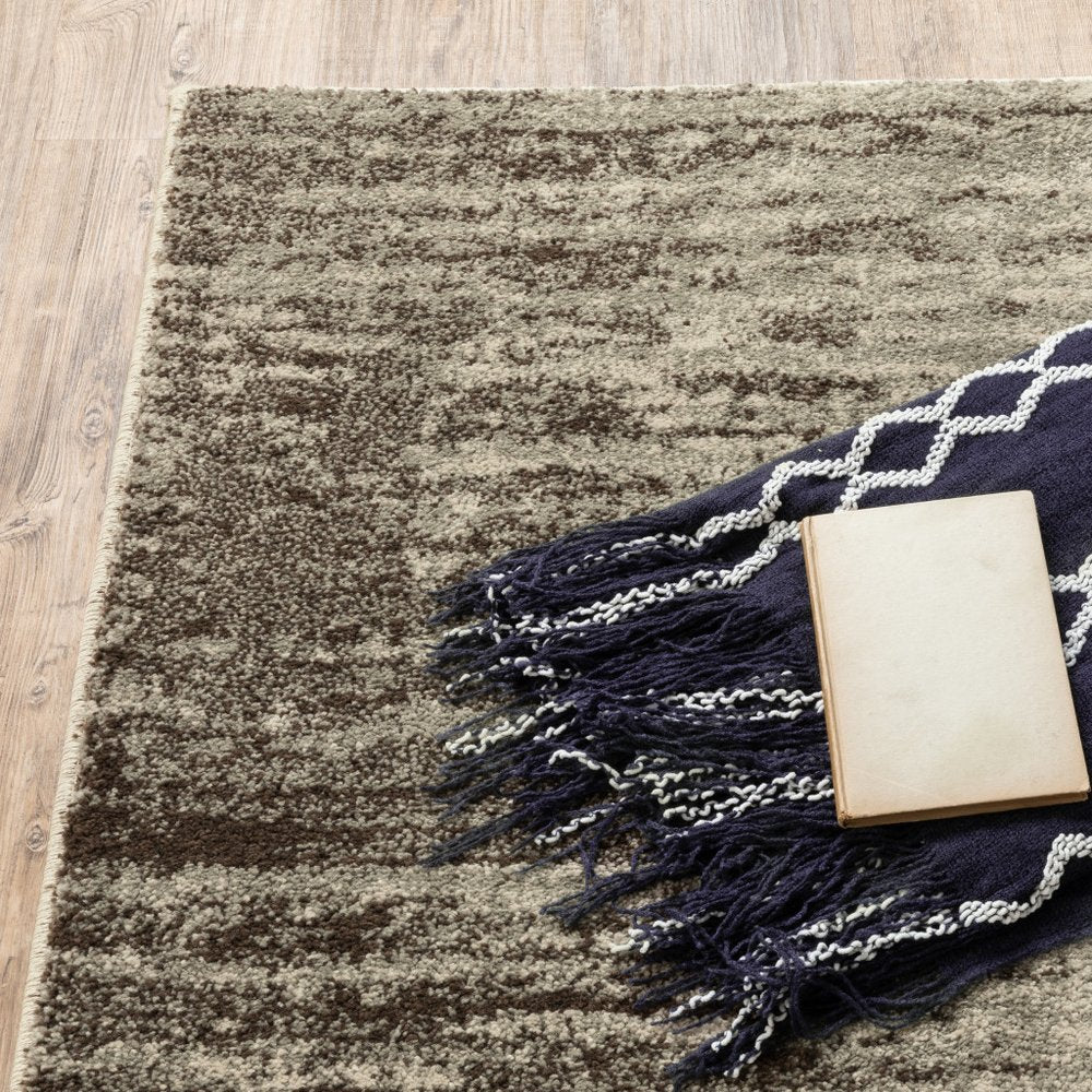 7' X 9' Beige And Ivory Abstract Shag Area Rug