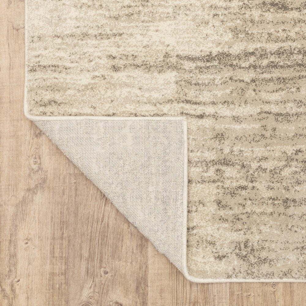 7' X 9' Beige And Ivory Abstract Shag Area Rug