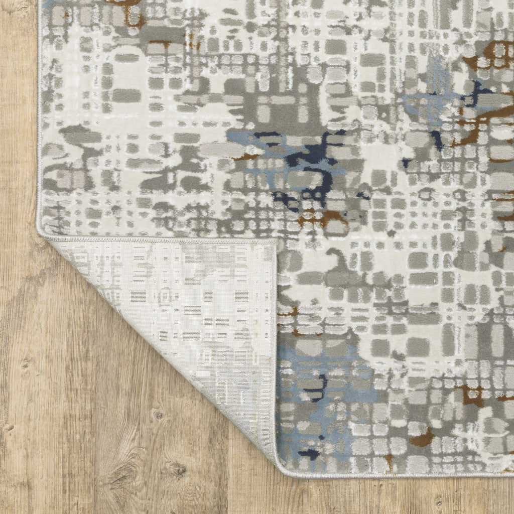 5' X 8' Blue Ivory Grey Brown Beige And Light Blue Abstract Power Loom Stain Resistant Area Rug