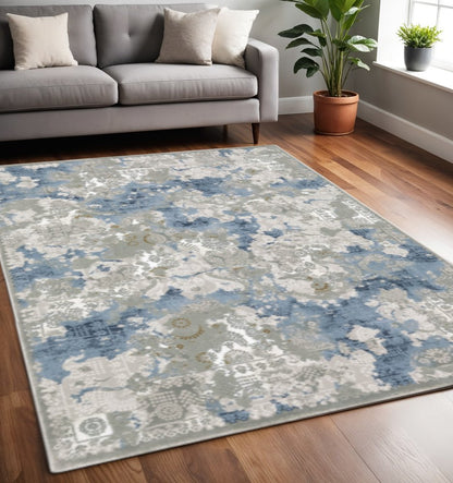 5' X 8' Grey Blue Ivory Navy Beige And Brown Abstract Power Loom Stain Resistant Area Rug